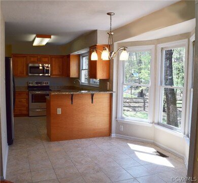 Recently renovated kitchen with beautiful cabinetry with rope accents and cushion close drawers. Plus, ceramic tile, bay window eat in area and stainless steel appliances.