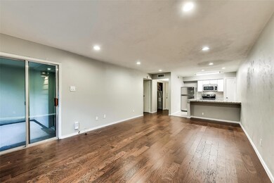Unfurnished living room with dark hardwood / wood-