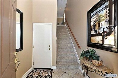 Entry at Foyer has Travertine Floor with Marble in