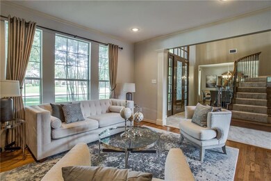 Front living room off the foyer with large windows