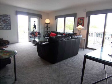Living Room. 3 Sets of Sliders to L shaped deck