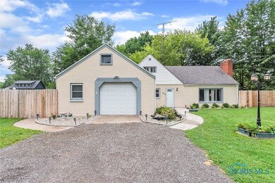 Drive with Ample Parking and Attached Garage