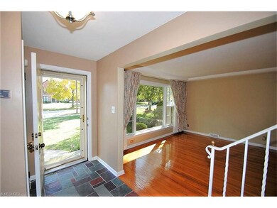 FRONT HALL OPENS TO LIVING ROOM