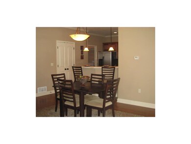 Pergo floors in the dining area make cleaning a br