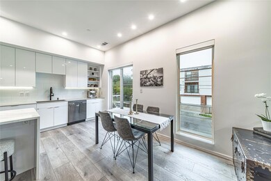 Dining room with visible vents, light wood-type fl