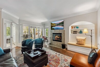 Living room featuring crown molding, healthy amoun