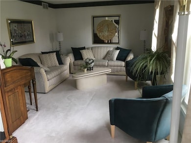 Entertain guests in this bright, formal living roo