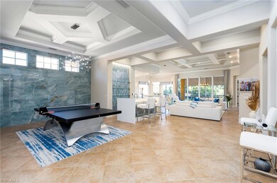 Rec room featuring coffered ceiling, beamed ceiling, crown molding, and light tile patterned floors