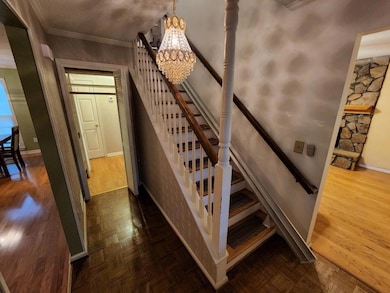 Entry Foyer with Stair Lift and Pass-Through to Rear Hall.