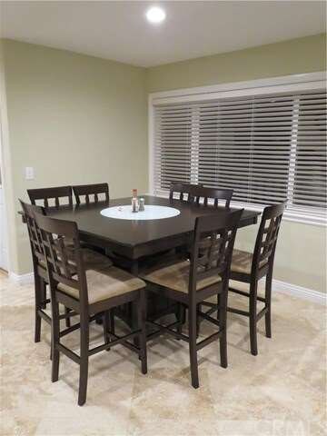 Dining area fits this 8-person table perfectly!