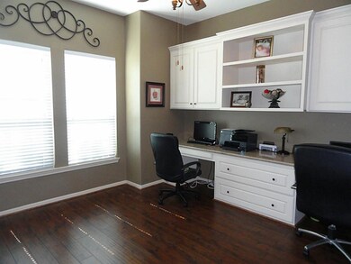 Large private study w/ laminate floors & built in desks & shelves/cabinets