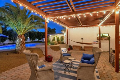 Twilight photo of lighted Pergola