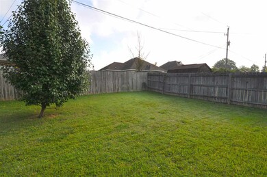 The fenced backyard offers plenty of room for the 