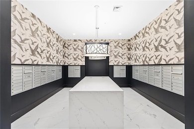 View of home's community with mail area, recessed lighting, and wallpapered walls