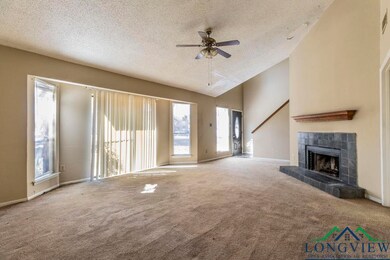 Unfurnished living room with carpet flooring, a ti