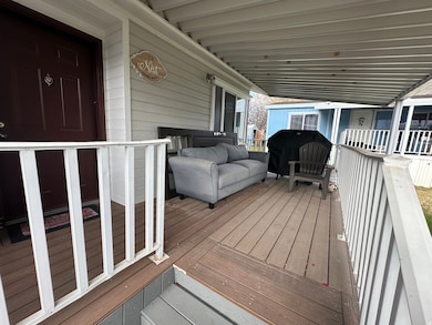 Wooden deck featuring a grill