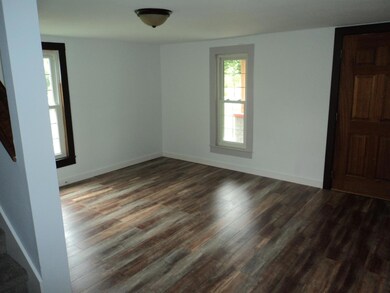 The living room is located on the front of the house