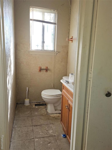 Bathroom featuring toilet and vanity