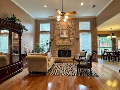 Living area with ornamental molding, ceiling fan w