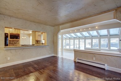 Family room open to kitchen and sunroom
