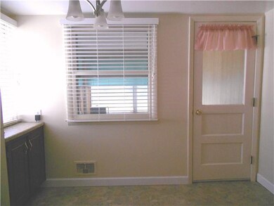 Kitchen. Dinette area of kitchen with door to Fla.