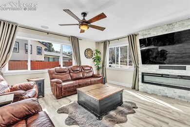 Living room featuring wood finished floors, ceilin