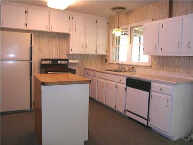 AN ALTERNATE VIEW OF THE KITCHEN FROM THE HEARTH A