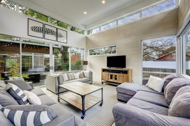 Living area with recessed lighting, a towering ce