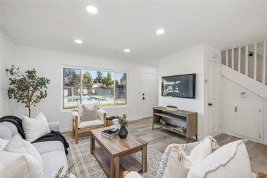 The view from the dining area into the living room.