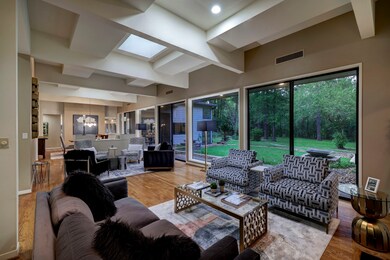 Step inside to gorgeous rooms with floor-to-ceiling windows, authentic Saltillo tile, and hardwood floors throughout.