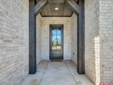 Entrance to property with brick siding