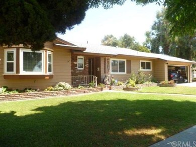 Front of Home showing 2 car garage, great curb appeal, shade trees, and single story ranch style home