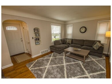 17 x 11 Living Room with Hardwood floors, plantation blinds, cove ceiling.