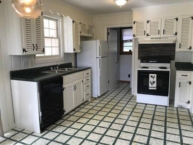 Light and bright kitchen with room for an island.