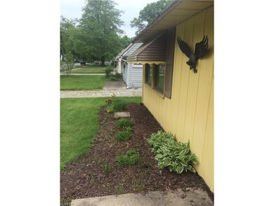 Nice landscaping.  Awnings add shade to cool house