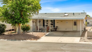 View of front of home with concrete driveway, a po