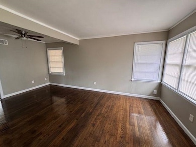 Empty room featuring baseboards, plenty of natural