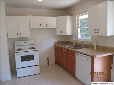 Kitchen with new floors and and bottom cabinets.
