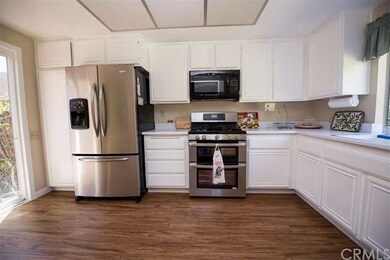 Kitchen with newly painted cabinets, with brand ne