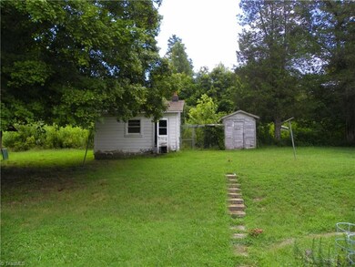 Storage sheds at back