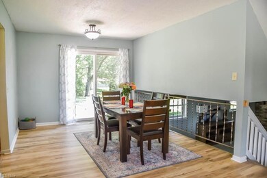 The dining room has a sliding door to the back pat