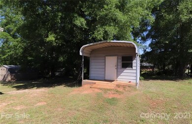 Large shed conveys with property.