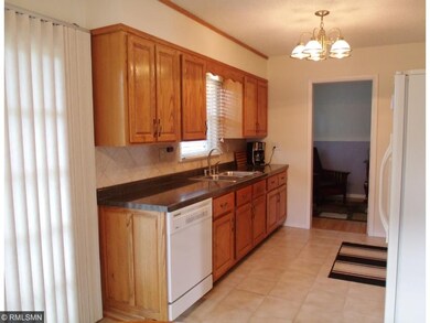 Kitchen is updated with beautiful cabinetry and ti