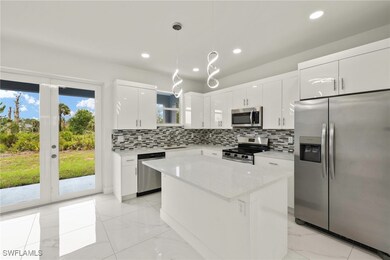 Kitchen with appliances with stainless steel finis