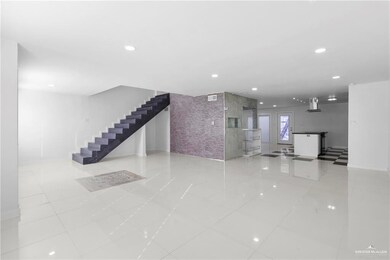 Unfurnished living room with light tile patterned floors