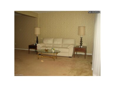 Flooring in the living room and dining room is a n