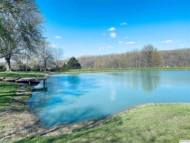 smaller pond is by the house. Has a dock and is st