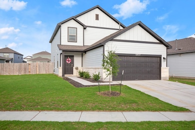 View of front of home featuring board and batten 