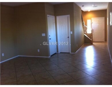 Living Room. LR, front hall, and foyer.  Door on l