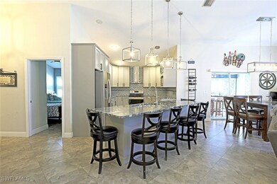 Kitchen featuring wall chimney range hood, dark st